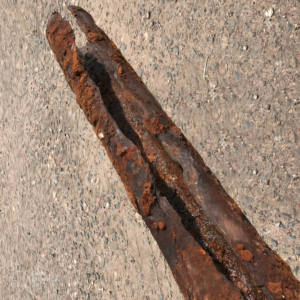 rotten cast iron pipe so rusted out it caused a crack down the middle